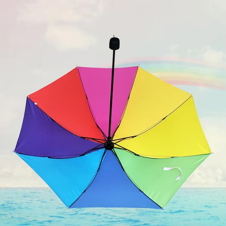 Kannettava 3-kertainen Rainbow-sateenvarjo